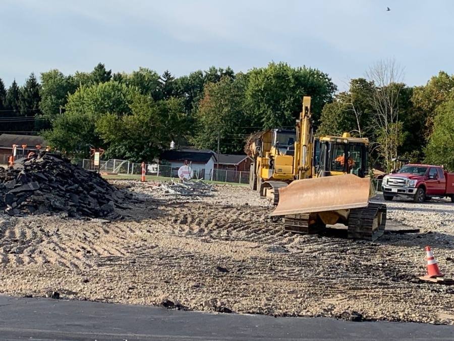 bull dozer and a pile of rubble